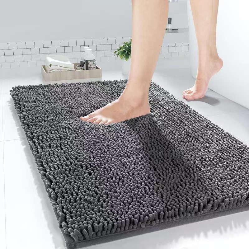 Stepping on a comfortable, non-slip, and water-absorbent mat after bathroom use.